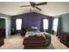 Spacious main bedroom with high ceilings, neutral carpet and gray and purple accent walls at 401 Lawton Dr, Haw River, NC 27258