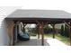 A covered patio with comfortable seating provides a relaxing outdoor space at 401 Lawton Dr, Haw River, NC 27258