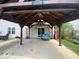Covered patio area with ample space for outdoor furniture and entertaining at 401 Lawton Dr, Haw River, NC 27258