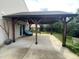 Covered patio with dark wood posts and a charming outdoor seating area at 401 Lawton Dr, Haw River, NC 27258