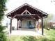 Covered patio features an open-air design, complete with cozy seating and views of the backyard at 401 Lawton Dr, Haw River, NC 27258