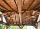 Ceiling view inside the covered pergola showing ceiling fans, wooden beams and lighting at 401 Lawton Dr, Haw River, NC 27258
