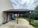 Covered pergola with comfortable outdoor seating and backyard view, perfect for entertaining at 401 Lawton Dr, Haw River, NC 27258