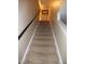 Carpeted staircase with a handrail leading to the upper level of the house at 401 Lawton Dr, Haw River, NC 27258