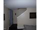 View of the stairway with fresh paint and a decorative window at 401 Lawton Dr, Haw River, NC 27258
