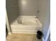 Modern white tub in gray-walled bathroom at 401 Lawton Dr, Haw River, NC 27258