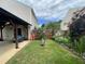 Backyard featuring a covered pergola, seating, and a fenced garden at 401 Lawton Dr, Haw River, NC 27258