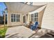 Backyard patio features a canvas awning, chairs, and view of the backyard at 405 Braxman Ln, Holly Springs, NC 27540