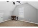 Bedroom with a large window, desk area, and cozy carpeting at 405 Braxman Ln, Holly Springs, NC 27540