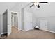 Bedroom featuring high ceilings, neutral paint, and multiple doors for easy access at 405 Braxman Ln, Holly Springs, NC 27540