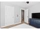 Bedroom featuring a ceiling fan, dresser, and closet space for ample storage at 405 Braxman Ln, Holly Springs, NC 27540