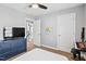 Bedroom featuring a TV, dresser, and a music keyboard with comfortable space at 405 Braxman Ln, Holly Springs, NC 27540