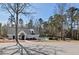Community pool with a clubhouse and landscaped surroundings at 405 Braxman Ln, Holly Springs, NC 27540