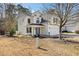 Two-story home with a well-kept lawn and a two-car garage at 405 Braxman Ln, Holly Springs, NC 27540