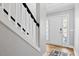 Inviting foyer featuring hardwood floors and a staircase at 405 Braxman Ln, Holly Springs, NC 27540