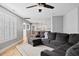 Spacious living room with hardwood floors and views into kitchen at 405 Braxman Ln, Holly Springs, NC 27540
