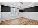 Cozy living room offering modern style and ample sunlight from the large window at 405 Braxman Ln, Holly Springs, NC 27540