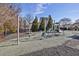 Community playground featuring climbing structures, slides, and a cushioned play area for hours of fun at 405 Braxman Ln, Holly Springs, NC 27540