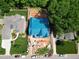 Overhead view of a new house under construction surrounded by green trees and lawns at 405 Latimer Rd, Raleigh, NC 27609