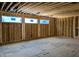 Spacious bedroom with large windows, framing, and unfinished walls at 405 Latimer Rd, Raleigh, NC 27609