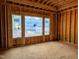 Spacious bedroom featuring unfinished walls and large windows offering serene views at 405 Latimer Rd, Raleigh, NC 27609