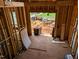 Home entryway showing unfinished walls, flooring and an exterior view at 405 Latimer Rd, Raleigh, NC 27609