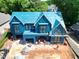 Aerial view of house under construction with blue sheathing and a two-car garage at 405 Latimer Rd, Raleigh, NC 27609