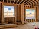 Unfinished room with window framing and subfloor at 405 Latimer Rd, Raleigh, NC 27609