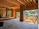 Spacious garage under construction with exposed beams and concrete floor overlooking the neighborhood at 405 Latimer Rd, Raleigh, NC 27609
