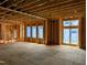 View of the unfinished living room with framing and windows at 405 Latimer Rd, Raleigh, NC 27609