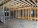 Upstairs of home under construction, featuring stud framing and a railing at 405 Latimer Rd, Raleigh, NC 27609
