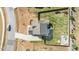 This aerial view shows a home with a spacious backyard, patio with a firepit, and a playground at 4412 Beckel Rd, Willow Springs, NC 27592