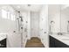 Modern bathroom featuring a frameless glass shower and stylish wood flooring at 4412 Beckel Rd, Willow Springs, NC 27592