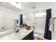Bathroom featuring a vanity with white countertop and a shower with dark shower curtain at 4412 Beckel Rd, Willow Springs, NC 27592