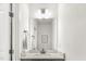 Bathroom featuring a sink with white countertops, white walls, and modern fixtures at 4412 Beckel Rd, Willow Springs, NC 27592