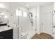 Bright bathroom featuring a frameless glass shower with herringbone tile at 4412 Beckel Rd, Willow Springs, NC 27592