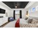 Bright bedroom with a bed, black ceiling, and lots of natural light at 4412 Beckel Rd, Willow Springs, NC 27592