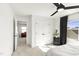 A bright bedroom features a black ceiling fan, plush carpeting and two closets for ample storage at 4412 Beckel Rd, Willow Springs, NC 27592
