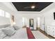 Bedroom featuring a stylish bed with a black ceiling and modern furnishings at 4412 Beckel Rd, Willow Springs, NC 27592