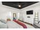 Bedroom featuring a stylish bed with a black ceiling and modern furnishings at 4412 Beckel Rd, Willow Springs, NC 27592