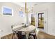 Eat-in dining area with contemporary lighting, neutral color palette and glass door to the backyard at 4412 Beckel Rd, Willow Springs, NC 27592
