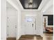 Inviting foyer featuring a front door with sidelights, white trim, and a view into the living area at 4412 Beckel Rd, Willow Springs, NC 27592