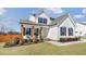 Charming two-story home with a well-manicured lawn and cozy front porch at 4412 Beckel Rd, Willow Springs, NC 27592