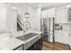 Kitchen with center island, stainless steel appliances, white cabinets, and quartz countertops at 4412 Beckel Rd, Willow Springs, NC 27592