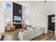 Spacious living room featuring high ceilings, a dark fireplace accent wall, and comfortable seating at 4412 Beckel Rd, Willow Springs, NC 27592