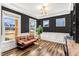 Spacious office featuring dark accent walls, wainscoting, ample natural light, and modern lighting fixtures at 4412 Beckel Rd, Willow Springs, NC 27592