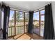 Screened porch with black curtains and wooden flooring at 4412 Beckel Rd, Willow Springs, NC 27592