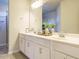Well-lit bathroom featuring double sinks, modern fixtures, and ample counter space at 50 Dover Ridge Ct, Chapel Hill, NC 27517