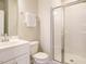Clean bathroom featuring a walk-in shower, white vanity, framed mirror, and a toilet at 50 Dover Ridge Ct, Chapel Hill, NC 27517