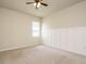 Cozy bedroom featuring wainscoting and a window with neutral carpet and plenty of natural light at 50 Dover Ridge Ct, Chapel Hill, NC 27517